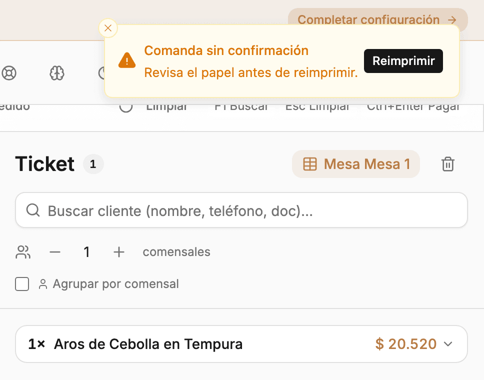 Aviso «Comanda sin confirmación» con el botón Reimprimir, junto al ticket de la mesa en el POS.
